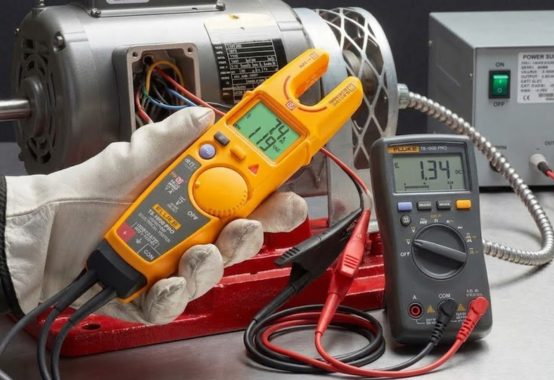 Commissioning engineer checking HVAC electrical wiring and checklists